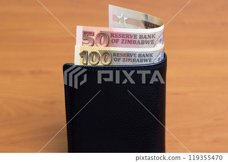Zimbabwean dollar in the black wallet 119355470