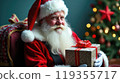 Santa Claus holds gift boxes. Christmas tree on festive background. Concept of Christmas and New Year 119355717