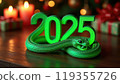 Green snake lies on the numbers of 2025. Symbol of the coming New Year 119355726