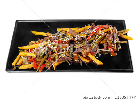 Fried french fries with pork meat and fried fern and vegetables on black plate on white background 119357477