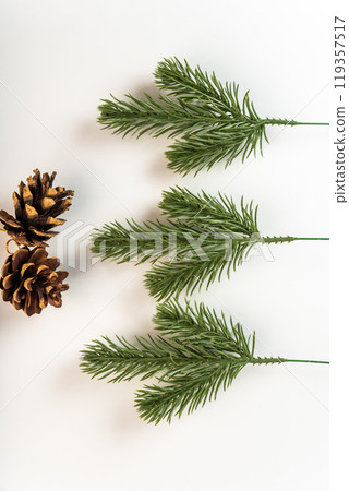 Fake fir tree branch for decorating of bouquets and home. 119357517