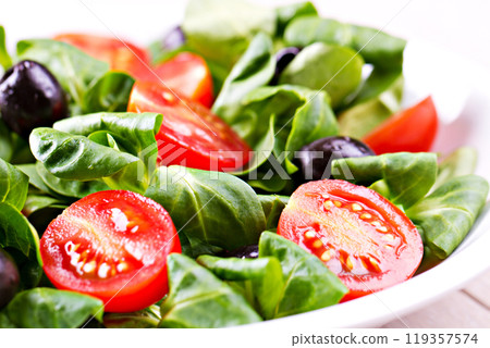 Mixed salad on a plate 119357574