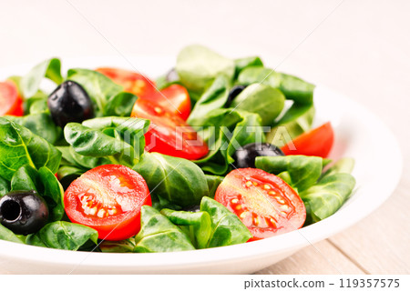 Mixed salad on a plate 119357575