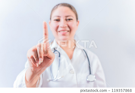 Female doctor counting number ONE isolated. Young female doctor counting number 1 on isolated background Female doctor counting number ONE isolated. Young female doctor counting number 1 on isolated background 119357868