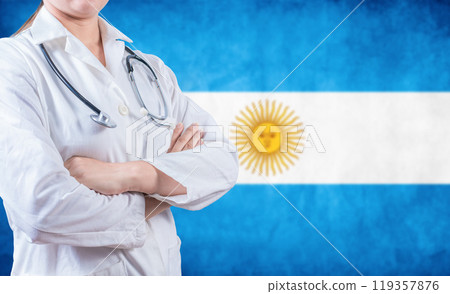 Argentine Health and Care concept. Female doctor holding stethoscope with Argentina flag 119357876