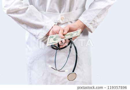 Corrupt doctor hiding money back, Dishonest doctor hiding money. Medical corruption and bribery concept Corrupt doctor hiding money back, Dishonest doctor hiding money. Medical corruption and bribery concept 119357896