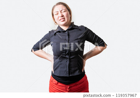 Suffering girl with back pain. Young woman with back pain. Lumbar problems concept. People with spine problems isolated Suffering girl with back pain. Young woman with back pain. Lumbar problems concept. People with spine problems isolated 119357967