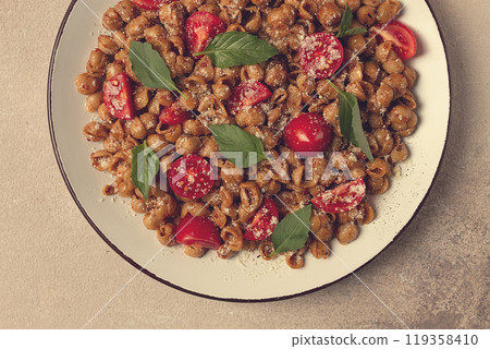Tuscan pasta with smoked paprika and basil,parmesan cheese, Italian traditional cuisine, Tuscan pasta with smoked paprika and basil,parmesan cheese, Italian traditional cuisine, 119358410