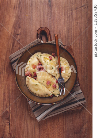 Dumplings, with fried prosciutto, a traditional dish of Polish cuisine, dumplings, top view, close-up, without people, 119358430