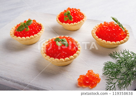 Tartlets with red caviar, on a light background, close-up, top view, no people, Tartlets with red caviar, on a light background, close-up, top view, no people, 119358638