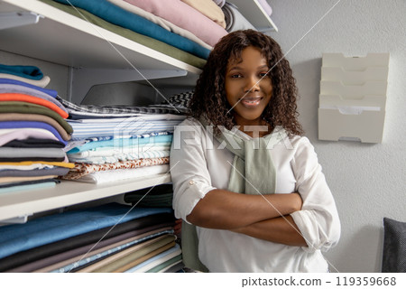 Woman shopper choosing sewing supplies in retail store 119359668