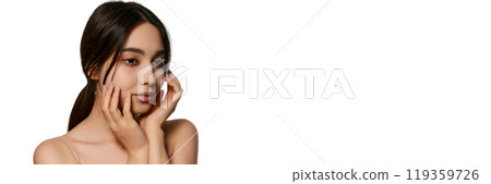 Beautiful young Korean woman with perfect smooth skin showing power of dedicated skincare routine and high-quality cosmetics. 119359726