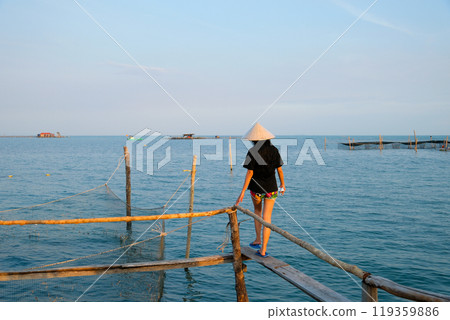 Beautiful natural scenery of fish farm. Tourist attractions . Fish farm wooden bridge ocean sea vietnam house on the water 119359886
