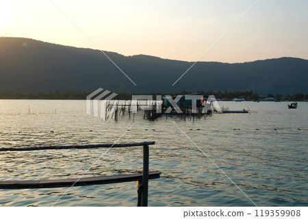 fishing village indian ocean on phu quoc island beautiful water surface fish fish farming wooden bridge house against the backdrop of extraordinary wild nature 119359908