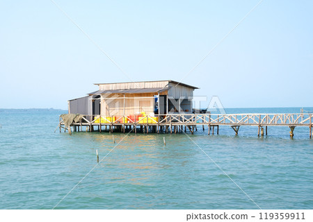 fishing village indian ocean on phu quoc island beautiful water surface fish fish farming wooden bridge house against the backdrop of extraordinary wild nature 119359911