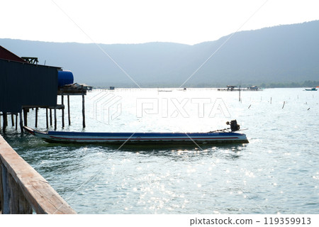 fishing village indian ocean on phu quoc island beautiful water surface fish fish farming wooden bridge house against the backdrop of extraordinary wild nature fishing village indian ocean on phu quoc island beautiful water surface fish fish farming wooden bridge house against the backdrop of extraordinary wild nature 119359913
