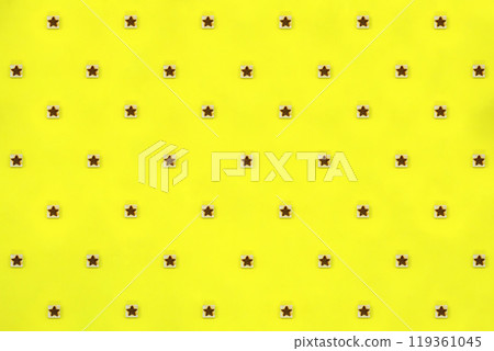 Pattern material with a yellow background of blocks with star marks Pattern material with a yellow background of blocks with star marks 119361045