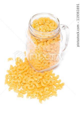 Uncooked Chifferi Rigati Pasta in Glass Jar Isolated on White 119361691