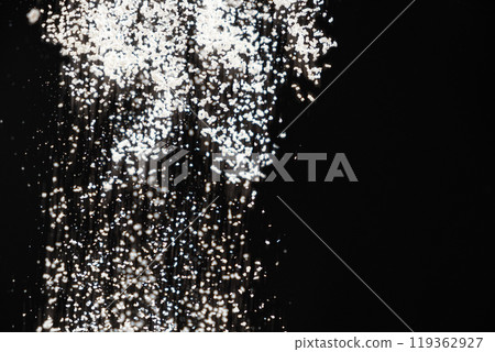 Abstract black and white background of pouring flour, space for text 119362927