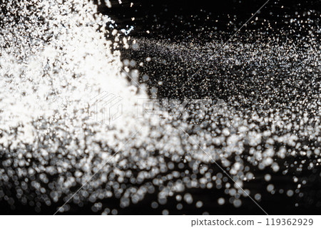 Abstract black and white background of pouring flour, space for text Abstract black and white background of pouring flour, space for text 119362929