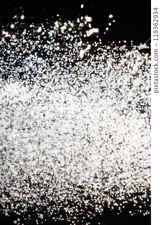 Abstract black and white background of pouring flour, space for text 119362934