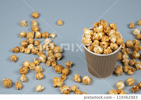 Sweet caramelized popcorn in a bucket. Sweet caramelized popcorn in a bucket. 119362983