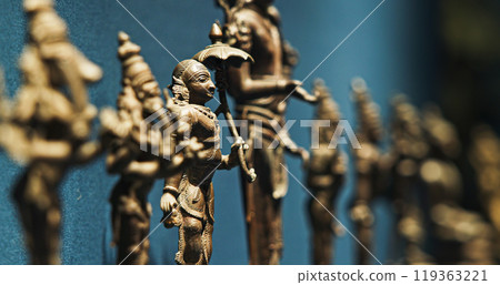Row Of Old Ancient Bronze Figurines Of Indian Deities And Avatars. 18-19th Century Ce. Close-up View On Vamana Avatara 119363221
