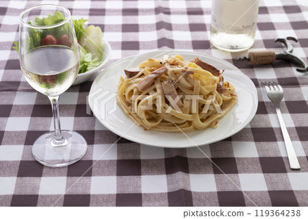 Carbonara and white wine 119364238