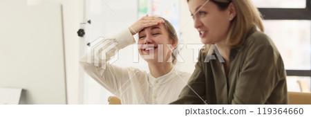 Cheerful women smile looking at screen of computer monitor Cheerful women smile looking at screen of computer monitor 119364660