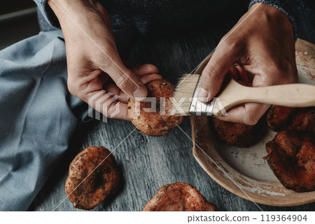 man cleans some rovellons, typical of Catalonia, Spain man cleans some rovellons, typical of Catalonia, Spain 119364904