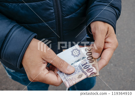 man has some hungarian forint notes in his hands man has some hungarian forint notes in his hands 119364910