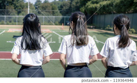 Rear view of three female students standing on a tennis court, generative AI_wide 119364946