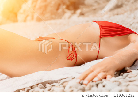 Bikini Beach Sunbathing Woman Relaxing on Beach Towel 119365252