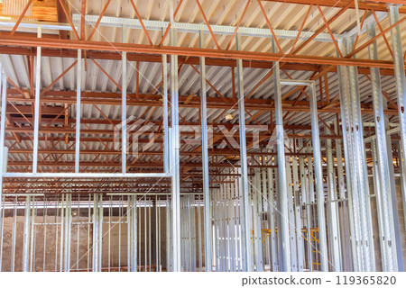 Large commercial building is constructed using steel beams profiles Large commercial building is constructed using steel beams profiles 119365820