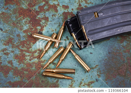 Ammunition with magazine on rusty metal Ammunition with magazine on rusty metal 119366104