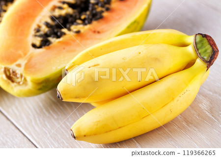 Bunch of Bananas and Papaya Isolated on a Background 119366265