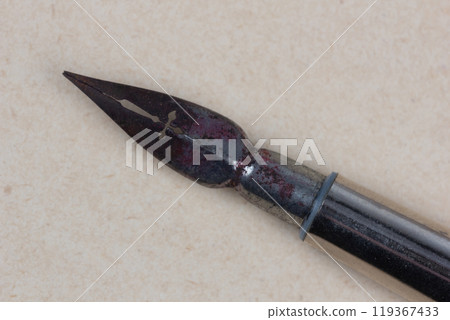 Fountain pen on an antique textured paper. 119367433