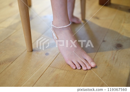 A friendship bracelet on the right ankle A friendship bracelet on the right ankle 119367560