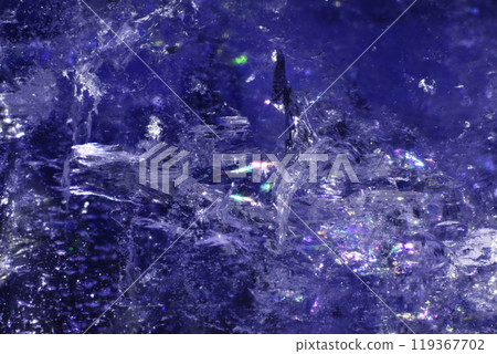 Close Up of a Rock Crystal with inclusions in Putple blue Rainbow 119367702