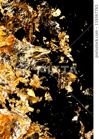 Gold Leaf Pieces Close Up on A Black Background as Decorative Pieces 119367765