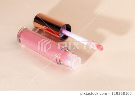 Lip gloss with applicator in light tubes. Cosmetic accessories. Lip gloss with applicator in light tubes. Cosmetic accessories. 119368163