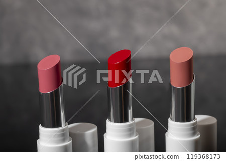 colored lipstick in light tubes. Cosmetic accessories. 119368173