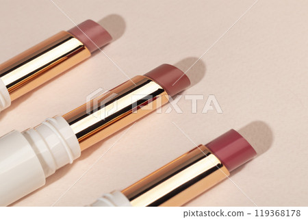 colored lipstick in light tubes. Cosmetic accessories. 119368178
