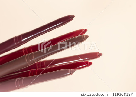 Differential pencils for lips and eyebrows close-up. Cosmetic product. 119368187