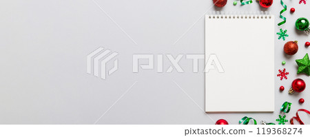 Christmas blank greeting card mock-up scene. Creative layout made of Christmas tree branches and paper card note. Flat lay. Nature New Year concept Christmas blank greeting card mock-up scene. Creative layout made of Christmas tree branches and paper card note. Flat lay. Nature New Year concept 119368274
