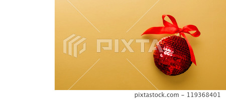 Christmas ball on colored background. decoration bauble with ribbon bow with copy space Christmas ball on colored background. decoration bauble with ribbon bow with copy space 119368401