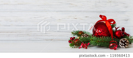 New Year Christmas tree toy, branches of a christmas tree, New Year decorations on a colored background New Year Christmas tree toy, branches of a christmas tree, New Year decorations on a colored background 119368413