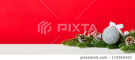 New Year Christmas tree toy, branches of a christmas tree, New Year decorations on a colored background New Year Christmas tree toy, branches of a christmas tree, New Year decorations on a colored background 119368483