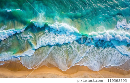 Large turquoise sea waves roll onto the sand 119368593