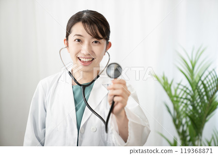 Female doctor with stethoscope 119368871